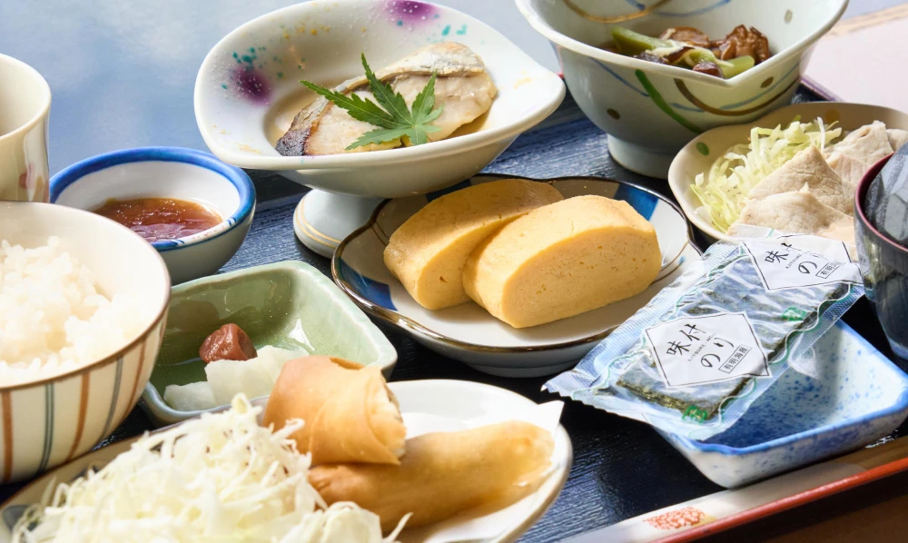 Daily Japanese set breakfast (rolled omelet, grilled fish and side dishes)